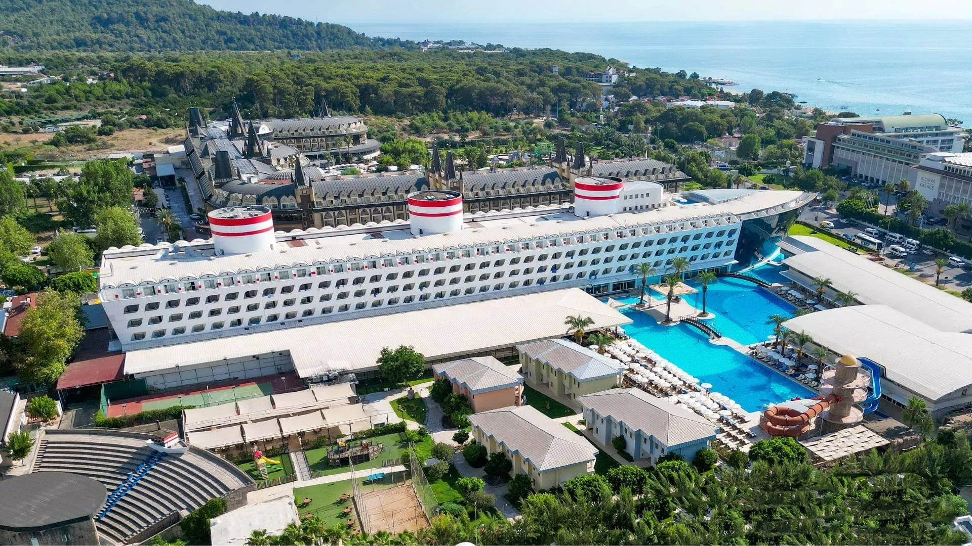 The ship-shaped hotel and its pools